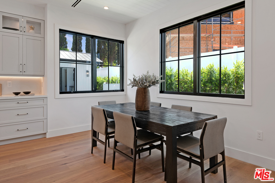 6310 Mirror Drive Los Angeles, CA 90068 - Photo 19 of 49 a view of a dining room with a table and chairs