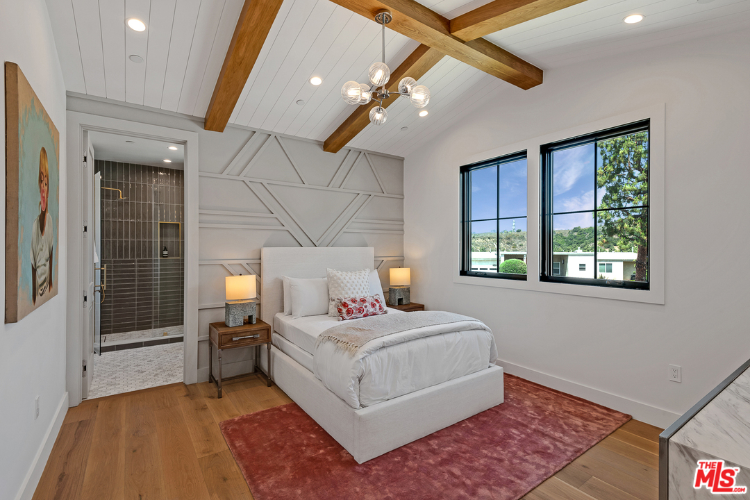 6310 Mirror Drive Los Angeles, CA 90068 - Photo 24 of 49 a living room with a bed furniture and a large window