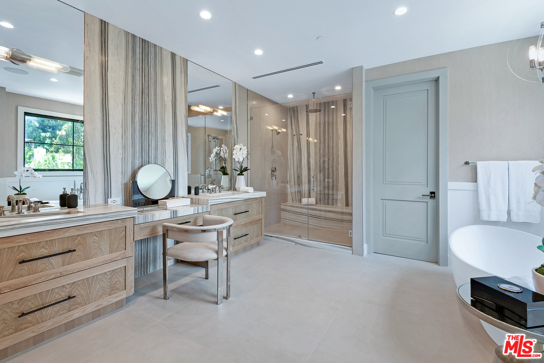 6310 Mirror Drive Los Angeles, CA 90068 - Photo 28 of 49 a room with a sink a chair and a large mirror