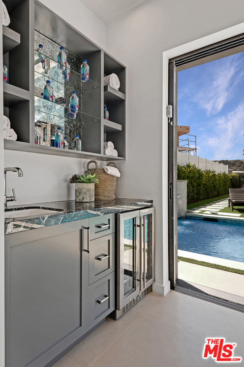 6310 Mirror Drive Los Angeles, CA 90068 - Photo 42 of 49 a kitchen with stainless steel appliances granite countertop a stove and a refrigerator