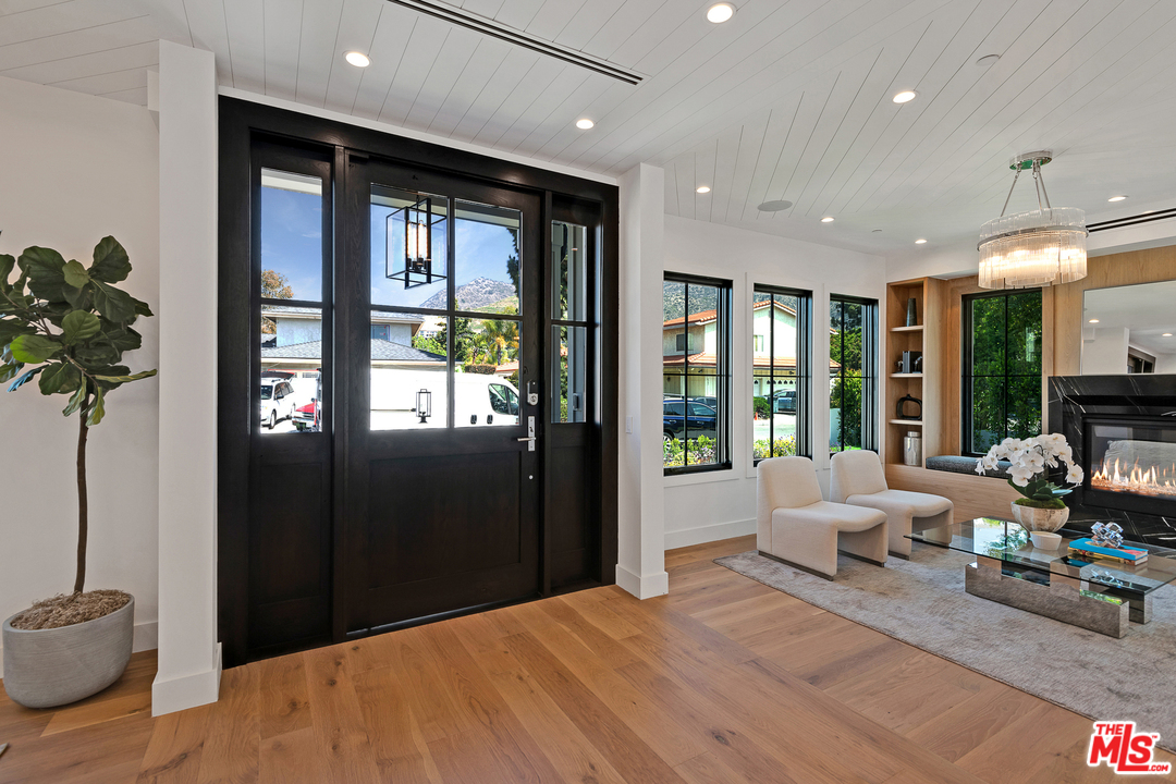 6310 Mirror Drive Los Angeles, CA 90068 - Photo 7 of 49 a bedroom with furniture and large windows