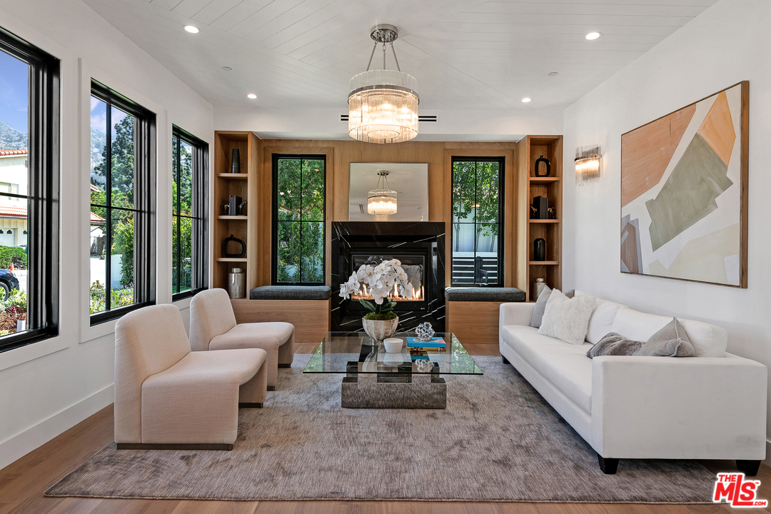 6310 Mirror Drive Los Angeles, CA 90068 - Photo 8 of 49 a living room with furniture chandelier and a large window