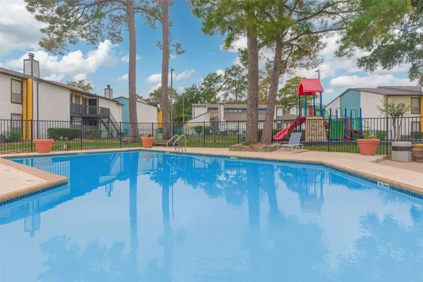 a view of a swimming pool with a patio