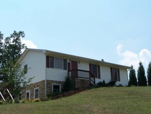 3359 Rutrough Road Southeast Roanoke, VA 24014 - Photo 1 of 1 a house that has a backyard
