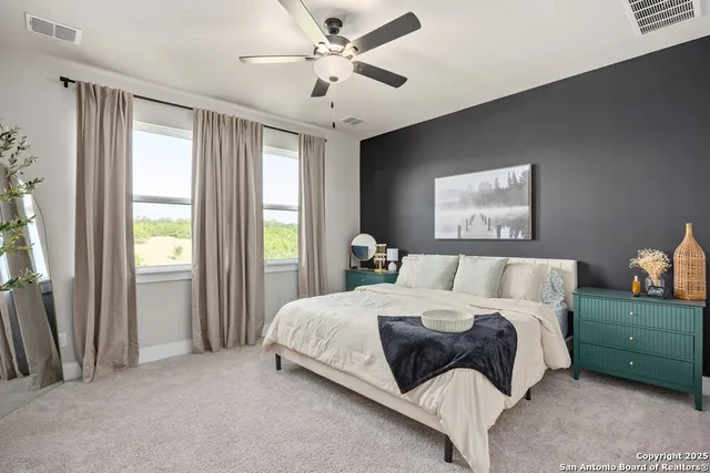 a en suite bathroom with double vanity sinks and a mirror