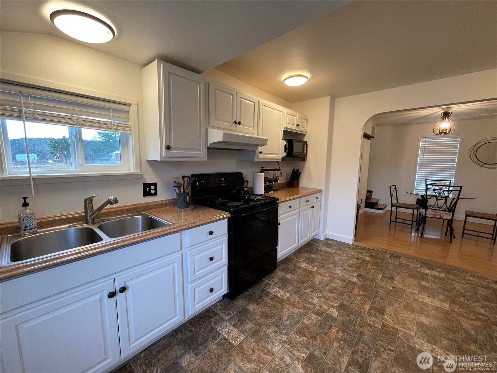 1707-1721 Fowler Road Raymond, WA 98577 - Photo 12 of 21 a kitchen with sink cabinets and outdoor view