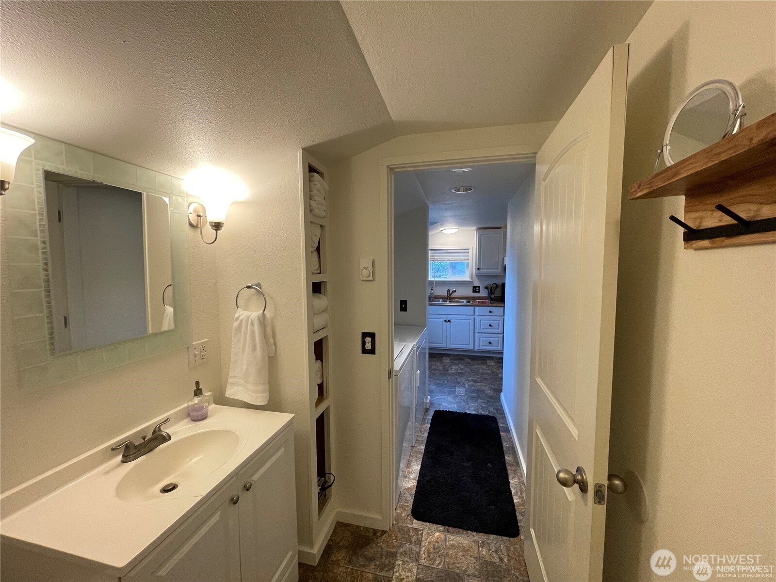 1707-1721 Fowler Road Raymond, WA 98577 - Photo 14 of 21 a view of a bathroom with a sink and mirror