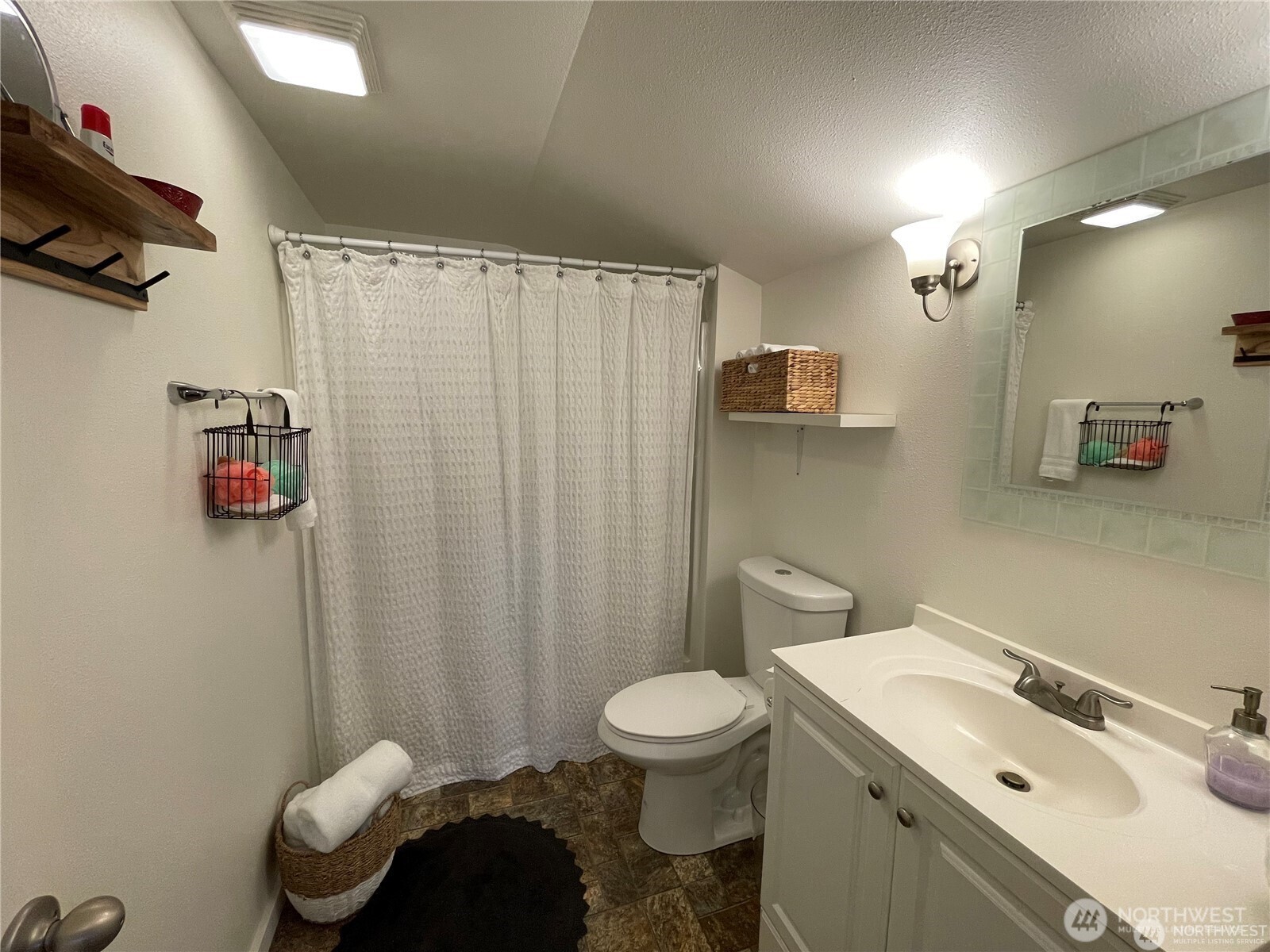 1707-1721 Fowler Road Raymond, WA 98577 - Photo 15 of 21 a bathroom with a sink toilet and shower