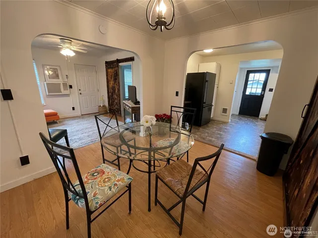 a view of a dining room with furniture and wooden floor