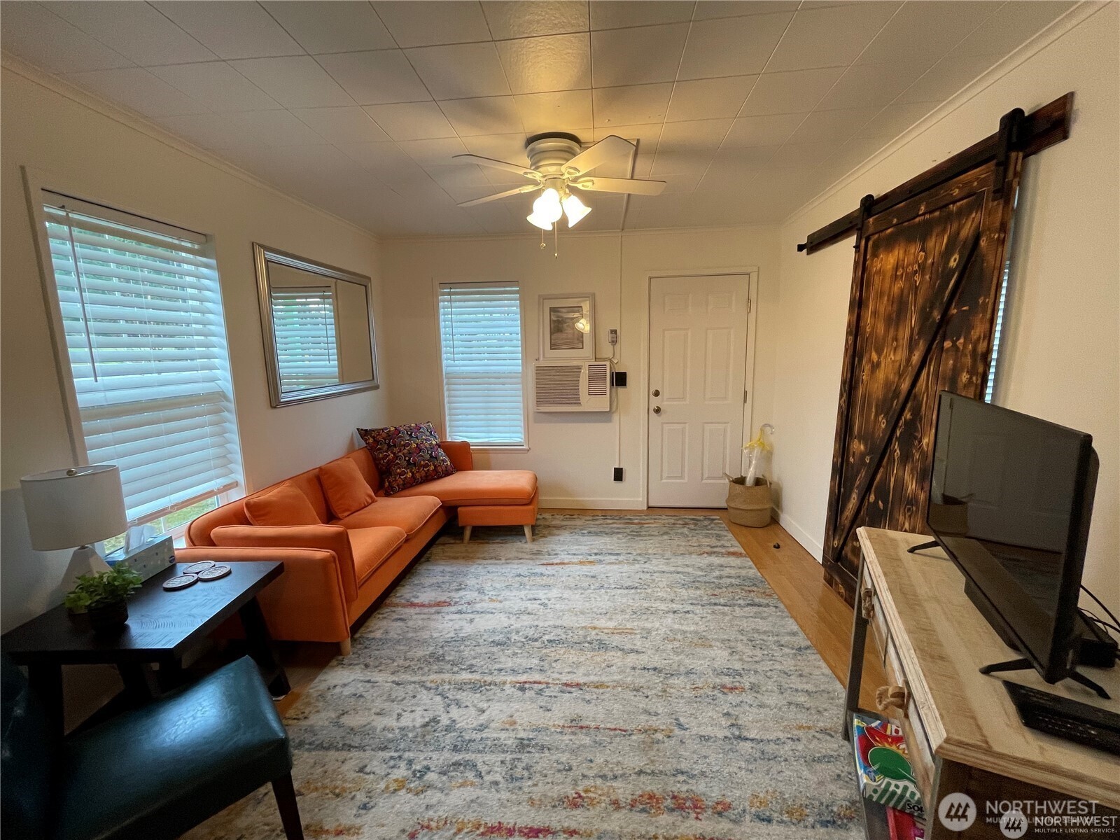 1707-1721 Fowler Road Raymond, WA 98577 - Photo 9 of 21 a living room with furniture and a flat screen tv