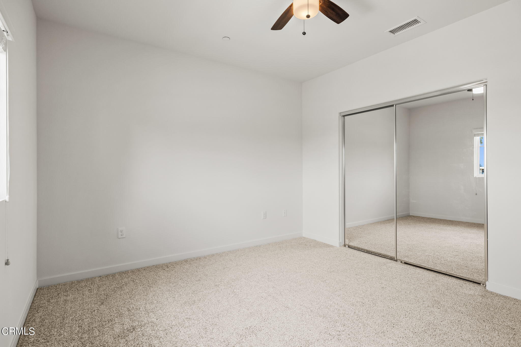 305 North F Street, Unit 201 Oxnard, CA 93030 - Photo 19 of 30 an empty room with view of ceiling fan