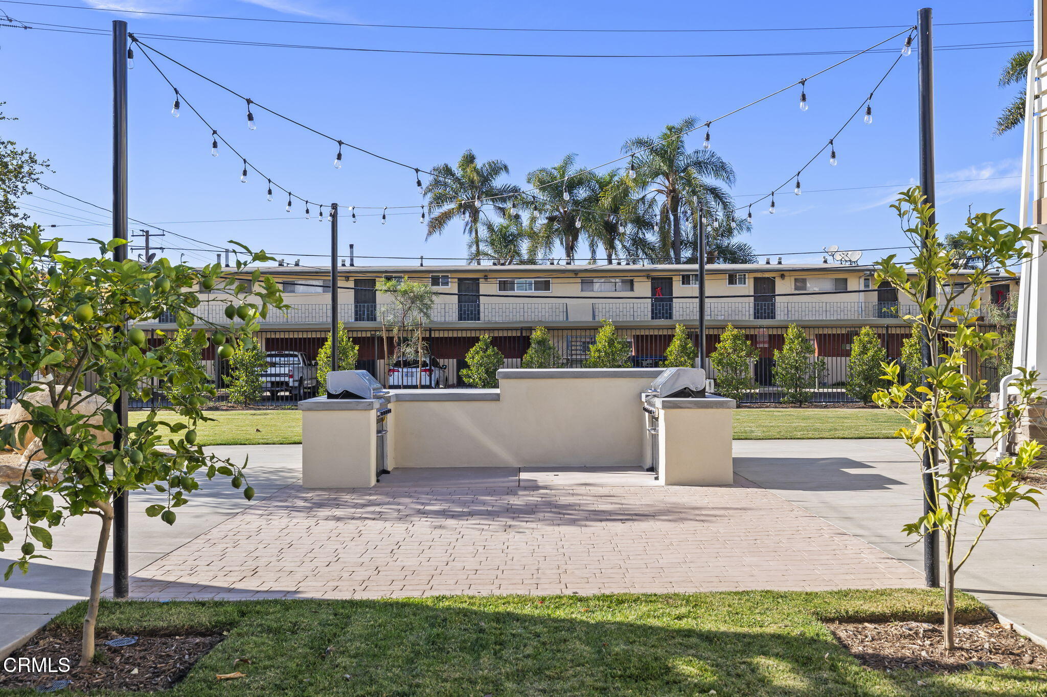 305 North F Street, Unit 201 Oxnard, CA 93030 - Photo 25 of 30 a view of a swimming pool with a patio