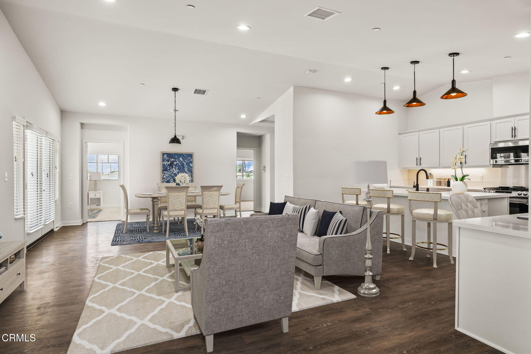 305 North F Street, Unit 201 Oxnard, CA 93030 - Photo 3 of 30 a living room with furniture and a wooden floor