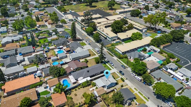 an aerial view of residential houses with outdoor space