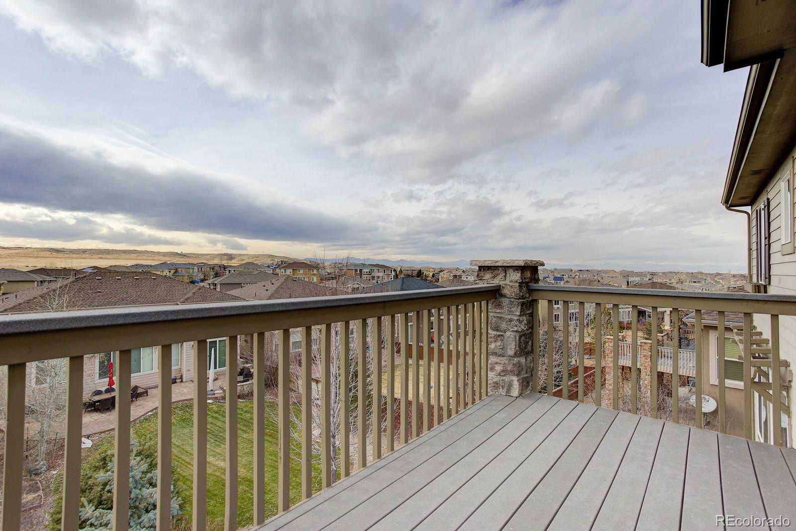 10879 Glengate Circle Highlands Ranch, CO 80130 - Photo 24 of 35 a balcony with wooden floor and city view