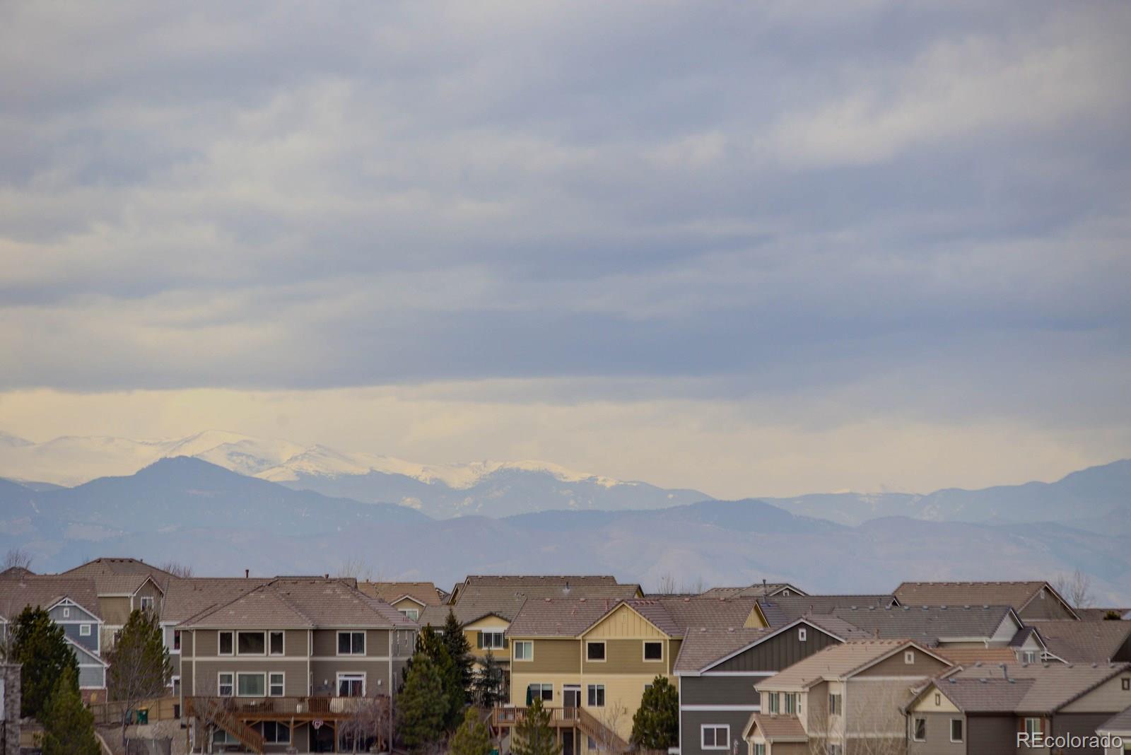 10879 Glengate Circle Highlands Ranch, CO 80130 - Photo 26 of 35 an aerial view of residential houses with a city view