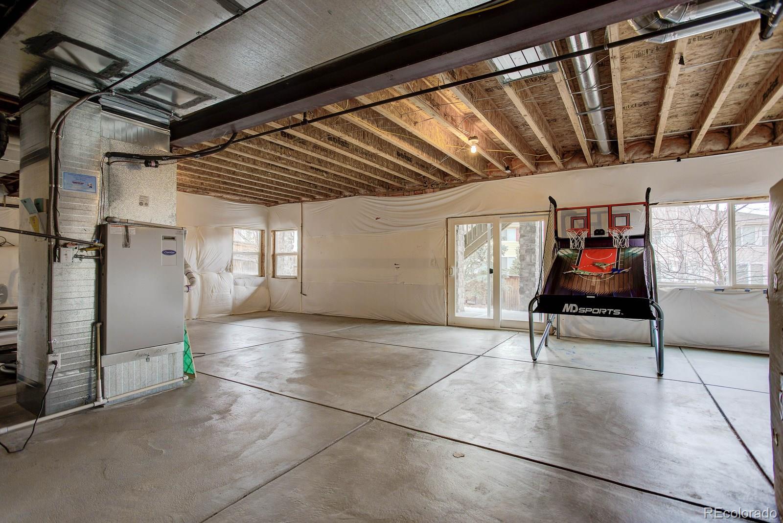 10879 Glengate Circle Highlands Ranch, CO 80130 - Photo 32 of 35 a view of an empty room with wooden floor