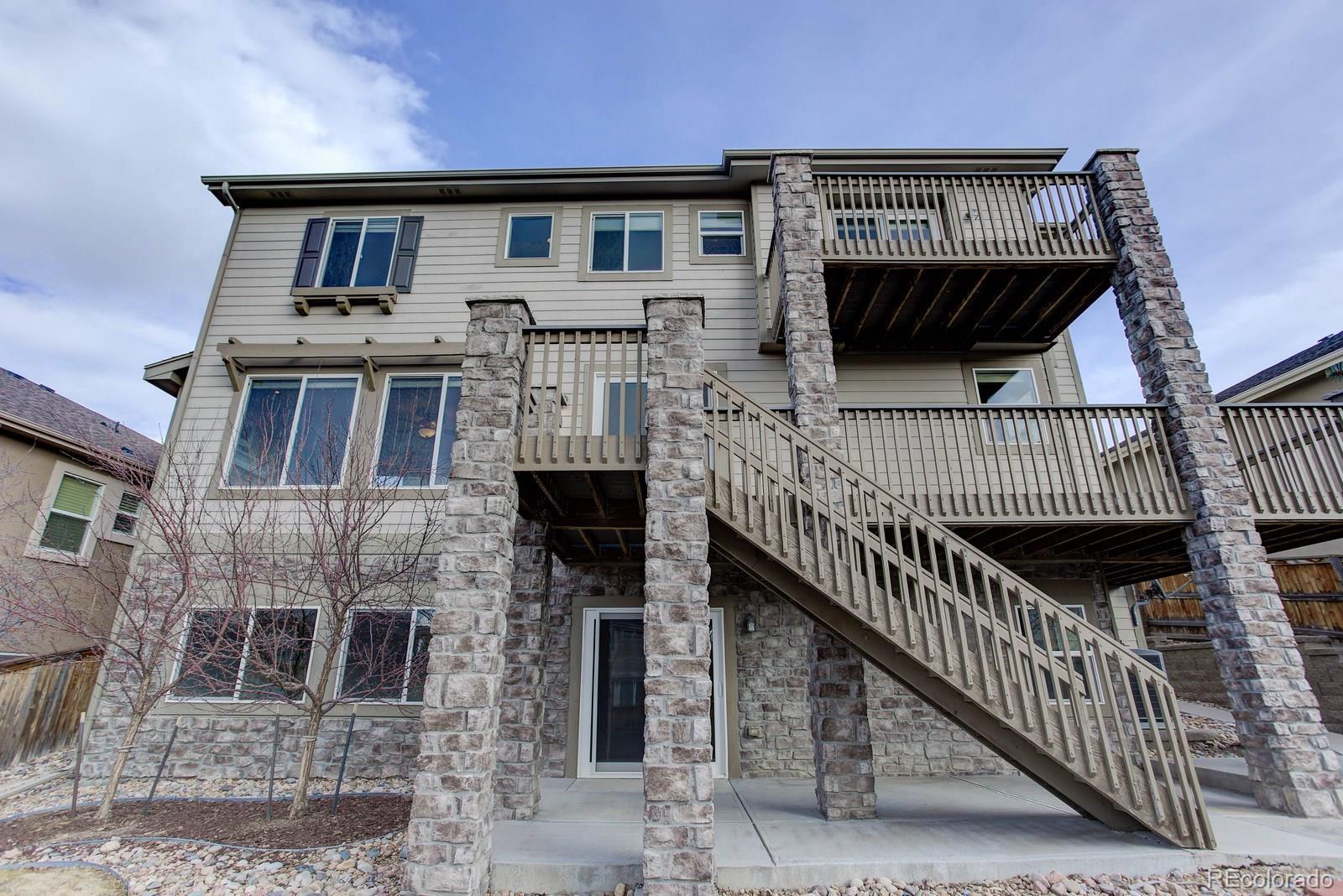 10879 Glengate Circle Highlands Ranch, CO 80130 - Photo 35 of 35 a front view of a house with iron stairs