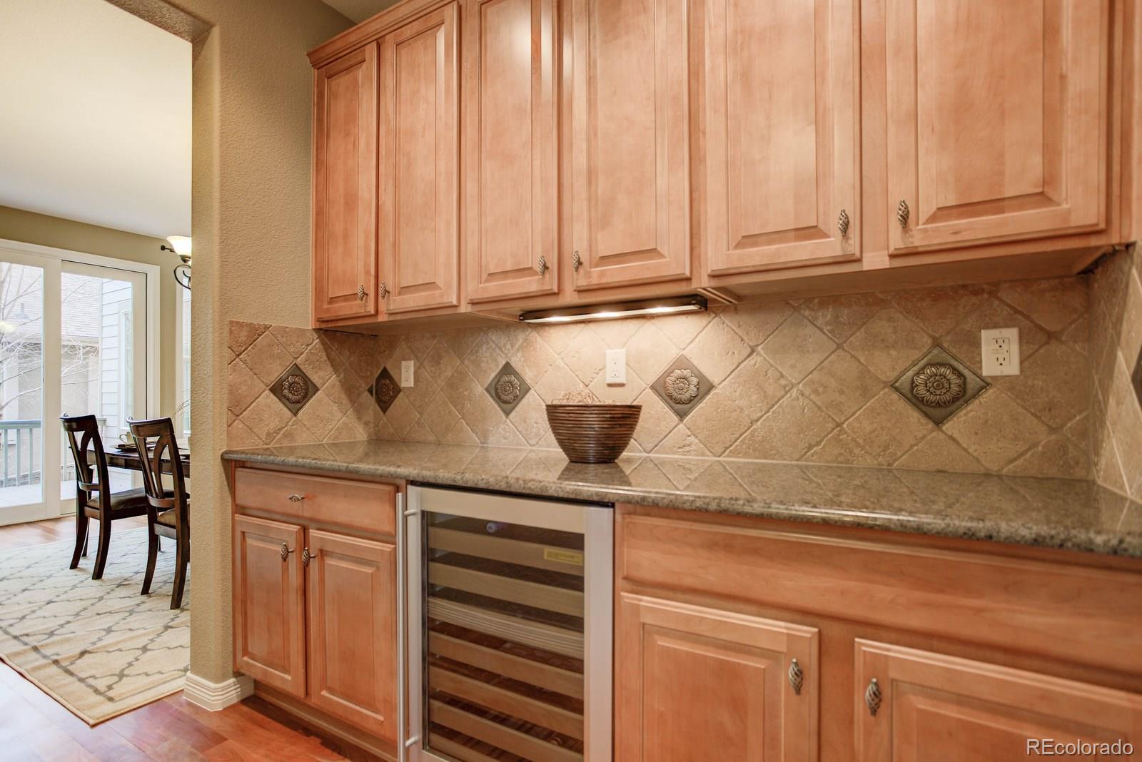 10879 Glengate Circle Highlands Ranch, CO 80130 - Photo 10 of 35 a kitchen with a sink and cabinets