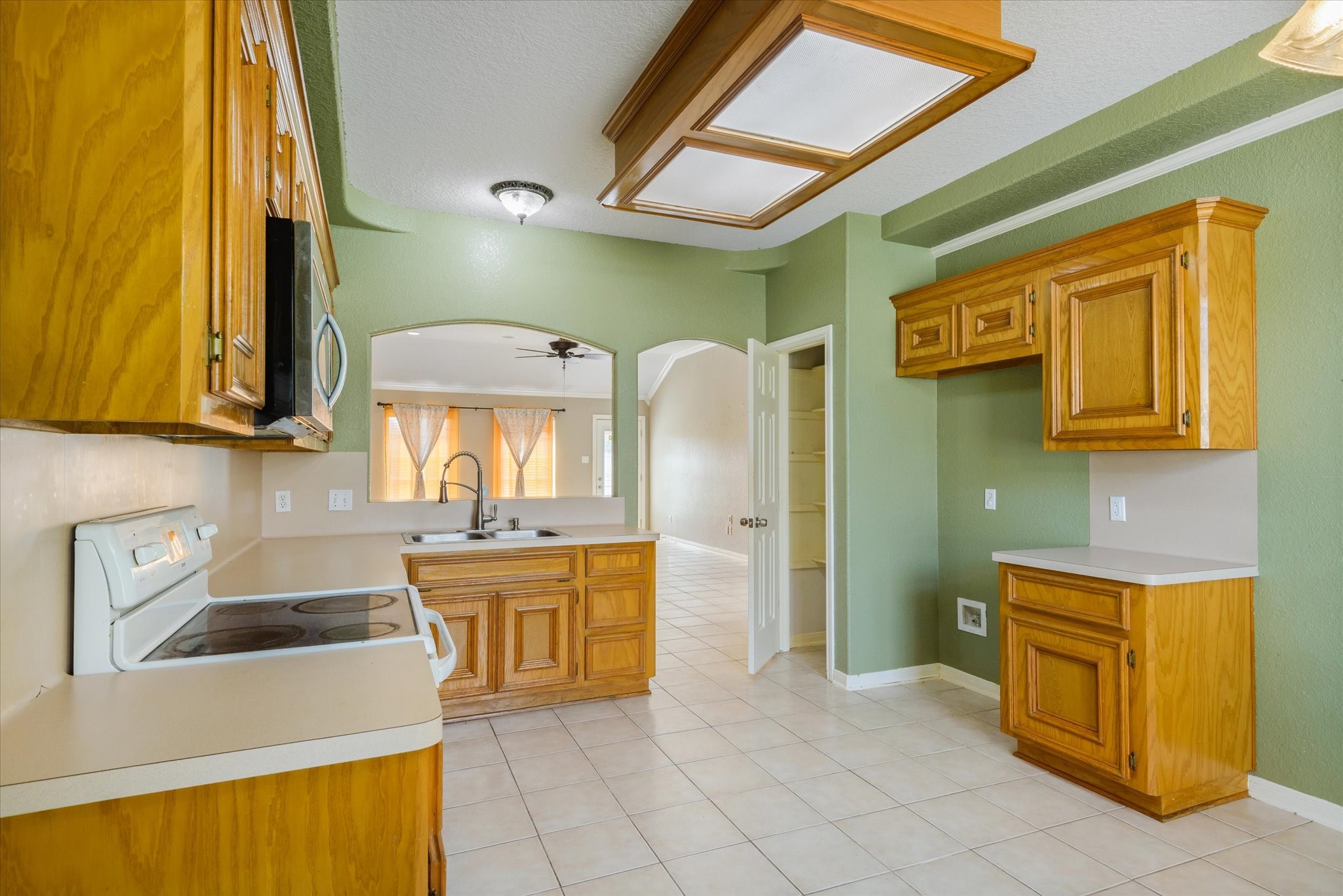 13331 Kaylee Lane Santa Fe, TX 77510 - Photo 10 of 28 Kitchen with wood cabinets and pantry.