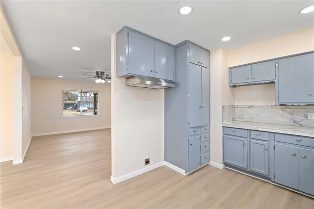 a view of a kitchen with electric appliances
