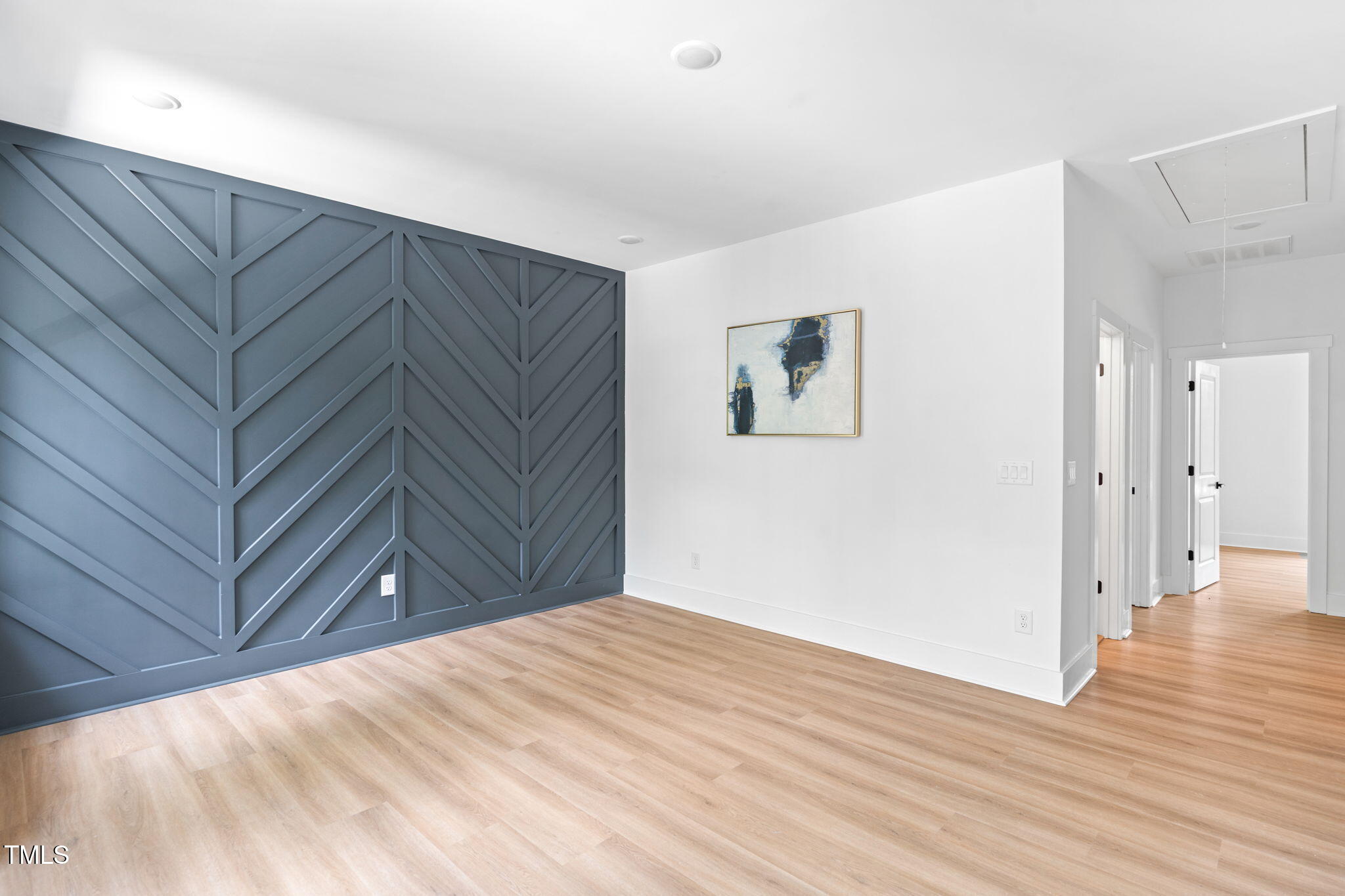 712 Oaks Lane Road Timberlake, NC 27583 - Photo 20 of 47 a view of a big room with wooden floor and cabinet