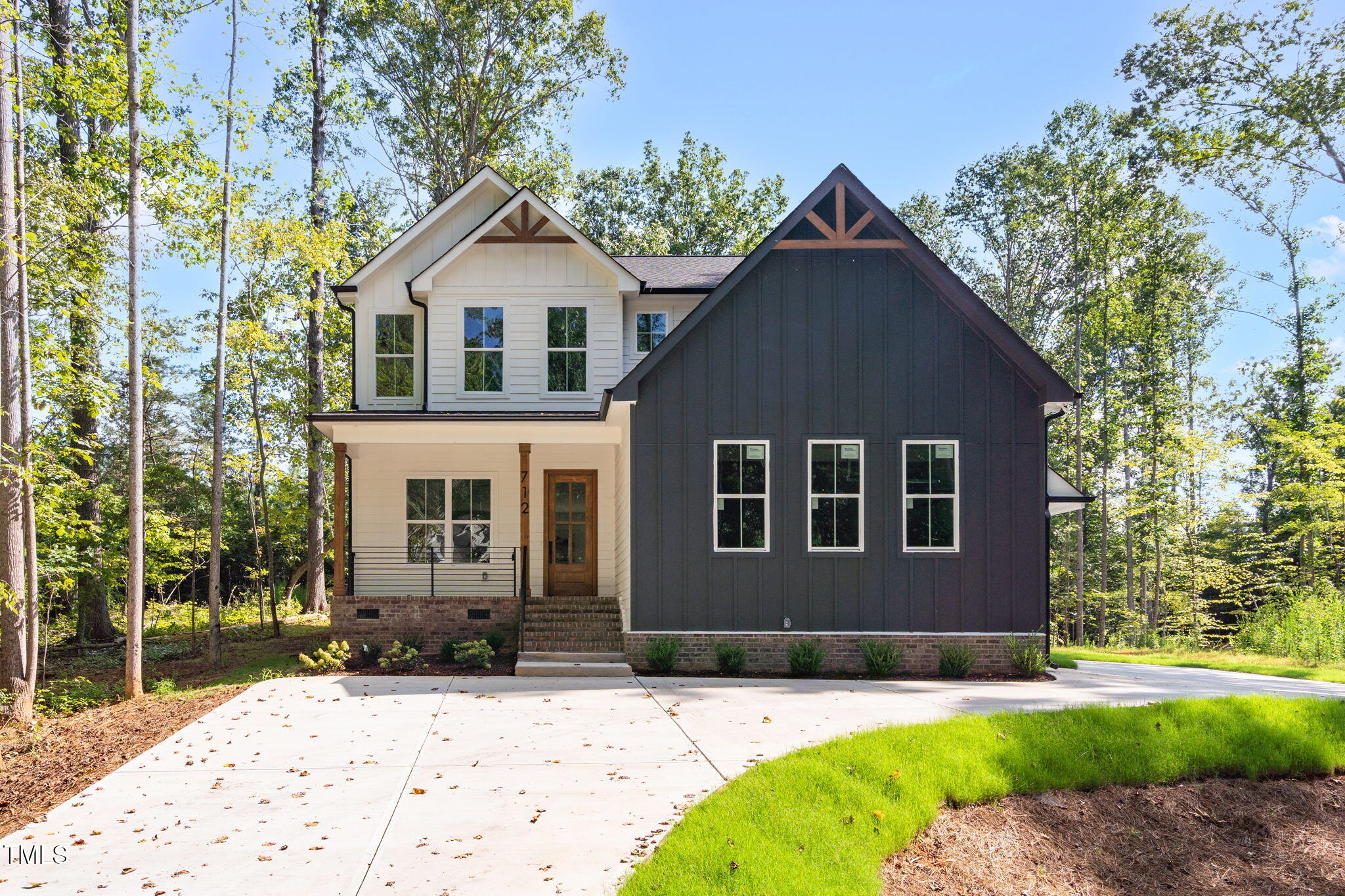 712 Oaks Lane Road Timberlake, NC 27583 - Photo 2 of 47 a front view of a house with a yard