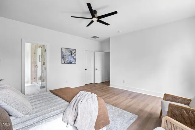 a bedroom with a bed and a dresser