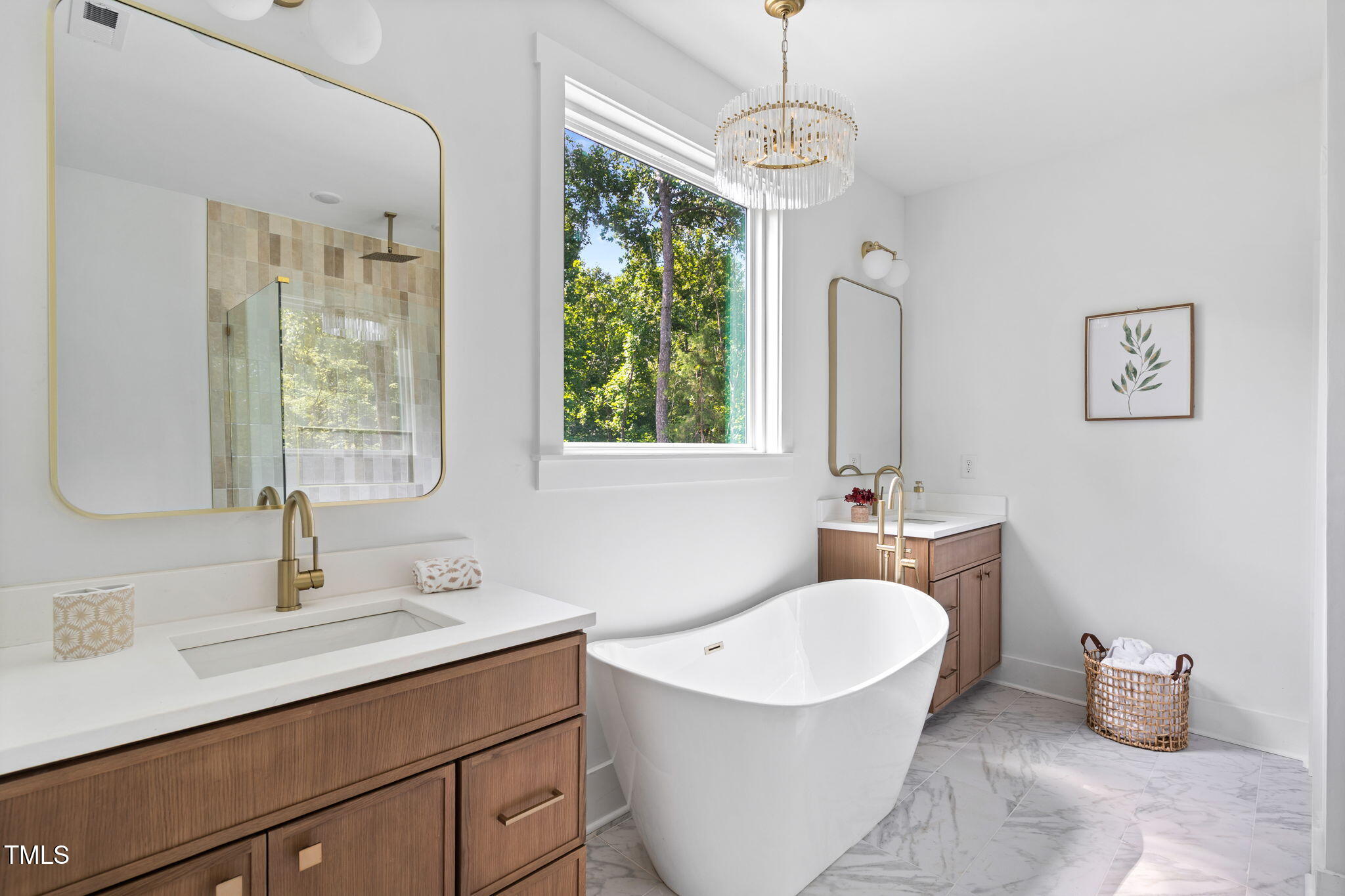 712 Oaks Lane Road Timberlake, NC 27583 - Photo 27 of 47 a bathroom with a double vanity sink a mirror and a bathtub