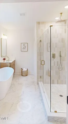 a spacious bathroom with a granite countertop sink a mirror and shower