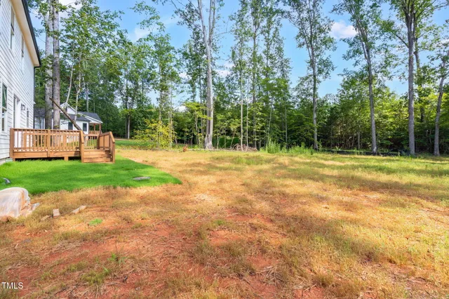 a swimming pool with trees in the background