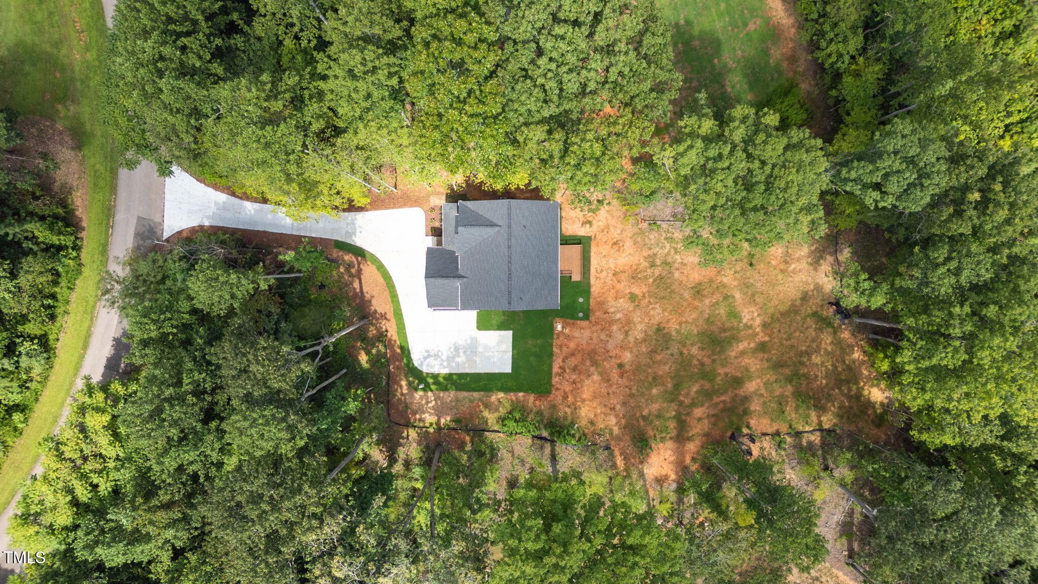 712 Oaks Lane Road Timberlake, NC 27583 - Photo 41 of 47 an aerial view of residential house with outdoor space and trees all around
