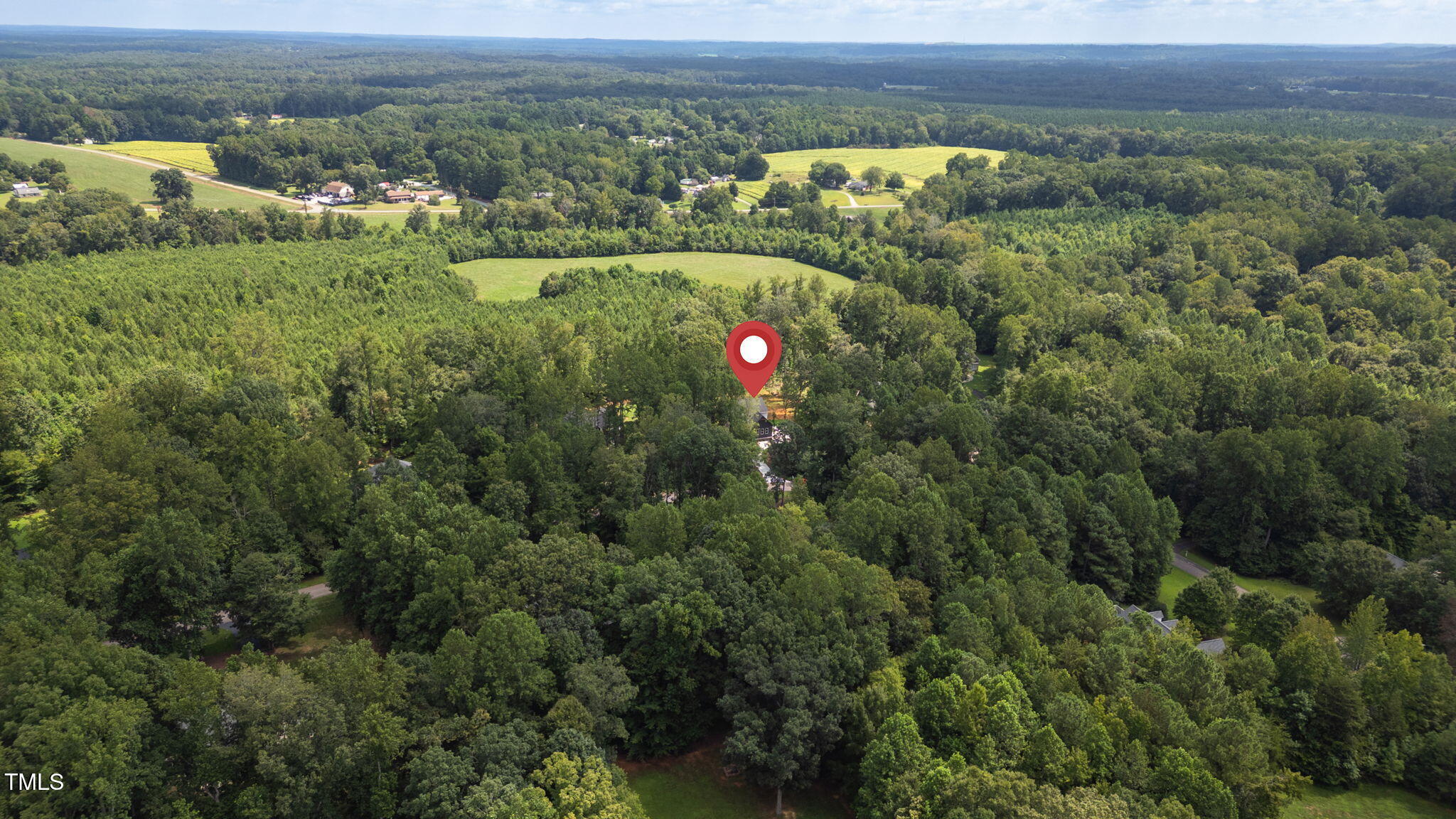 712 Oaks Lane Road Timberlake, NC 27583 - Photo 44 of 47 an aerial view of residential houses with outdoor space and trees