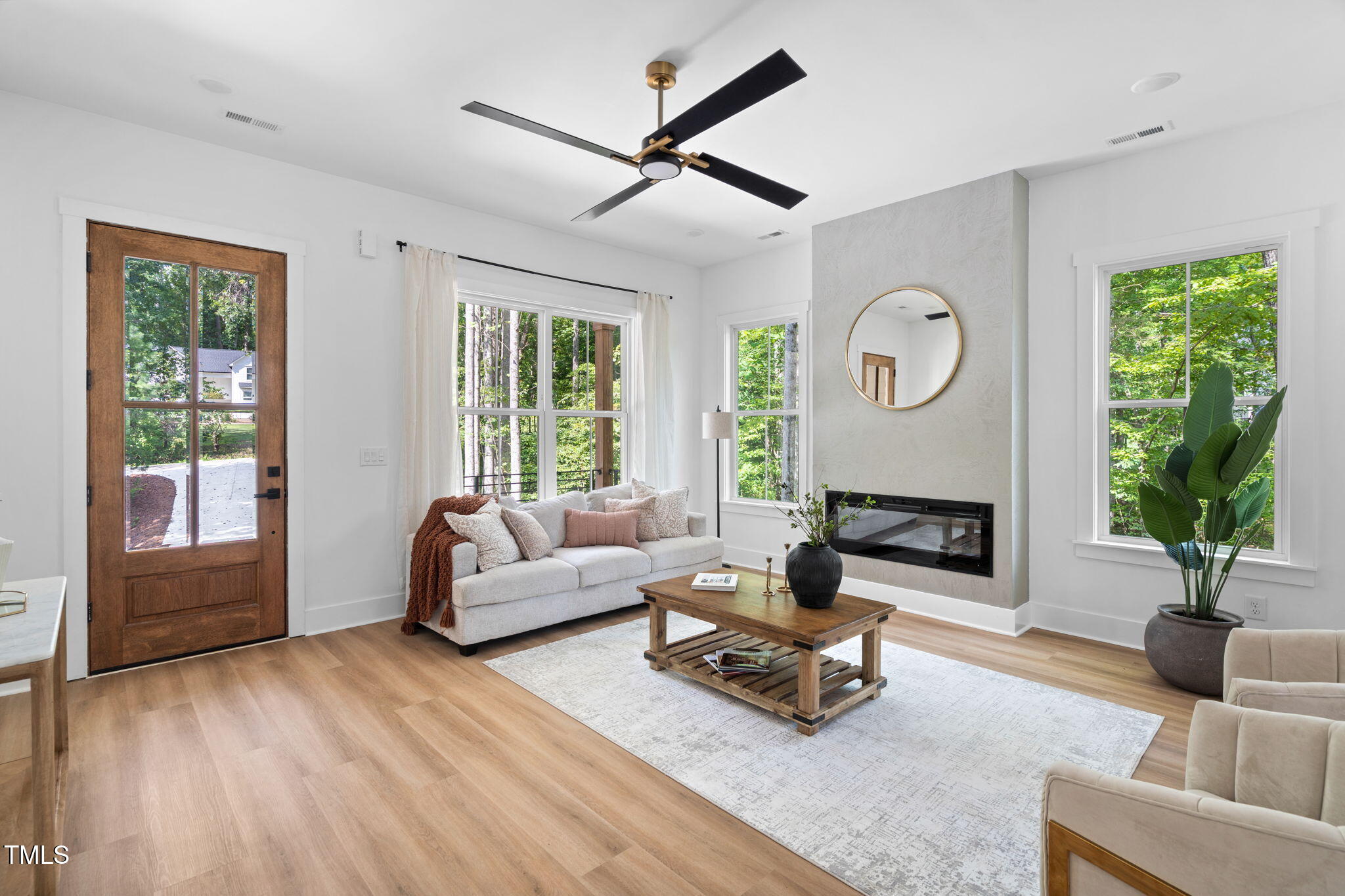 712 Oaks Lane Road Timberlake, NC 27583 - Photo 8 of 47 a living room with furniture and a large window