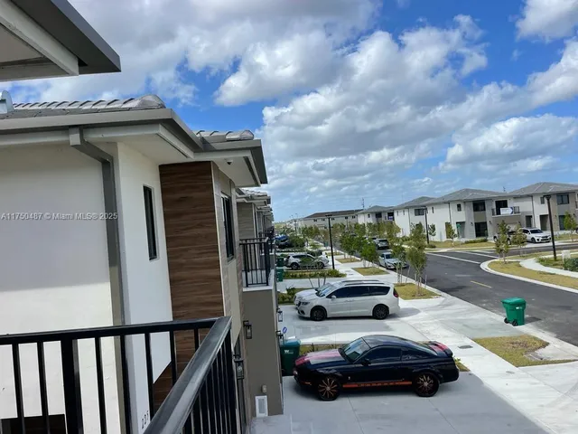 a view of a car parked in front of a building