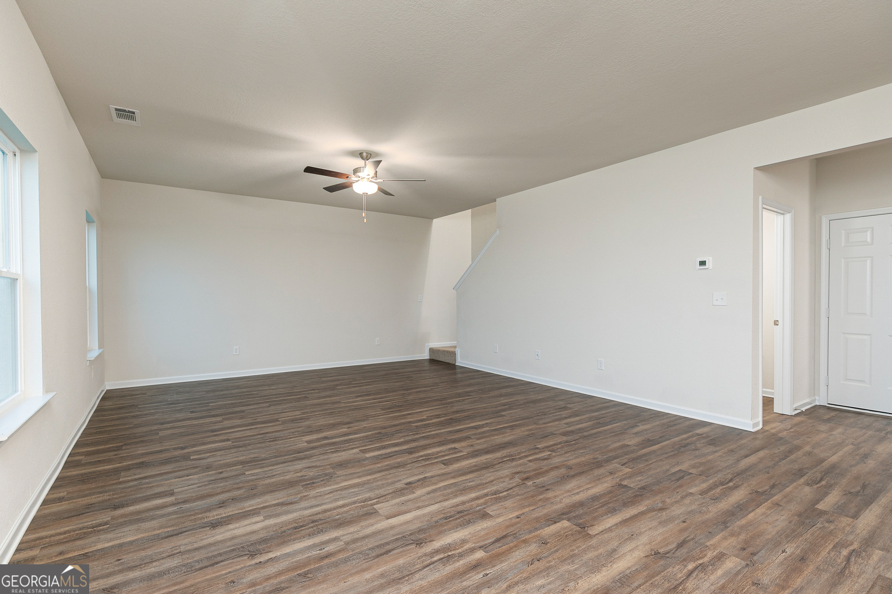 1513 Big Lane Locust Grove, GA 30248 - Photo 14 of 39 a view of empty room with wooden floor
