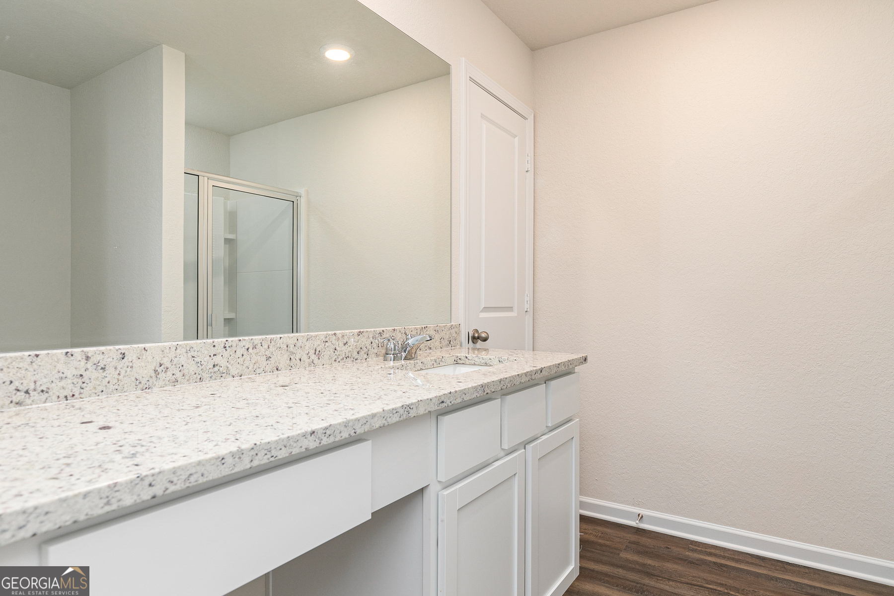 1513 Big Lane Locust Grove, GA 30248 - Photo 17 of 39 a bathroom with a granite countertop sink and a mirror