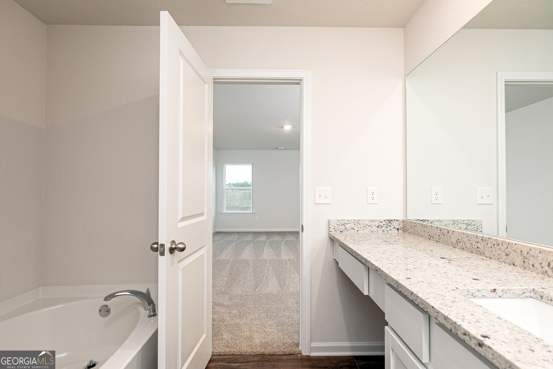 1513 Big Lane Locust Grove, GA 30248 - Photo 18 of 39 a bathroom with a granite countertop sink and a bathtub