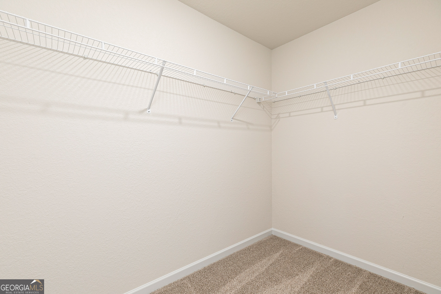 1513 Big Lane Locust Grove, GA 30248 - Photo 19 of 39 a view of a room with racks on the wall