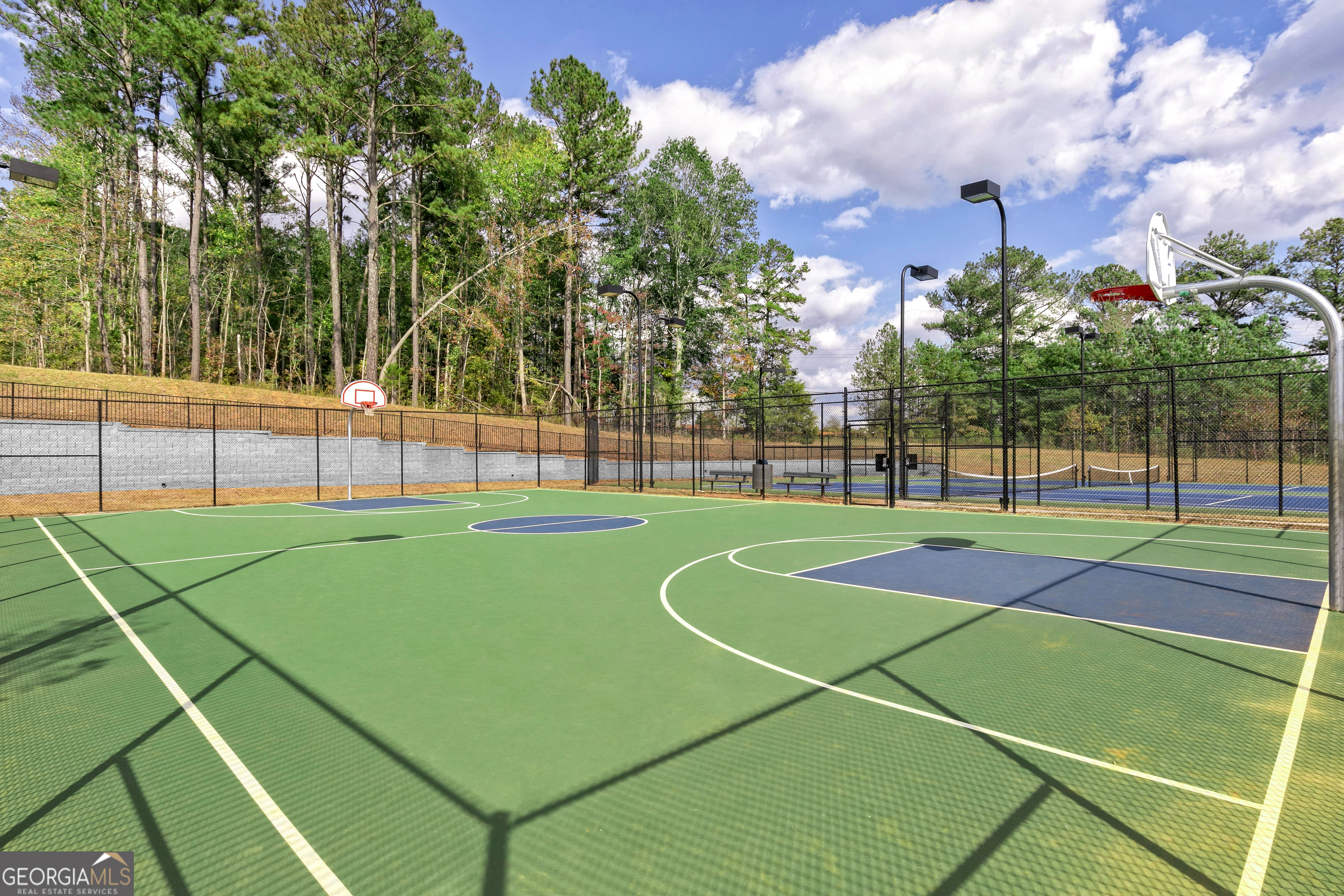 1513 Big Lane Locust Grove, GA 30248 - Photo 24 of 39 a view of a tennis ground with large trees