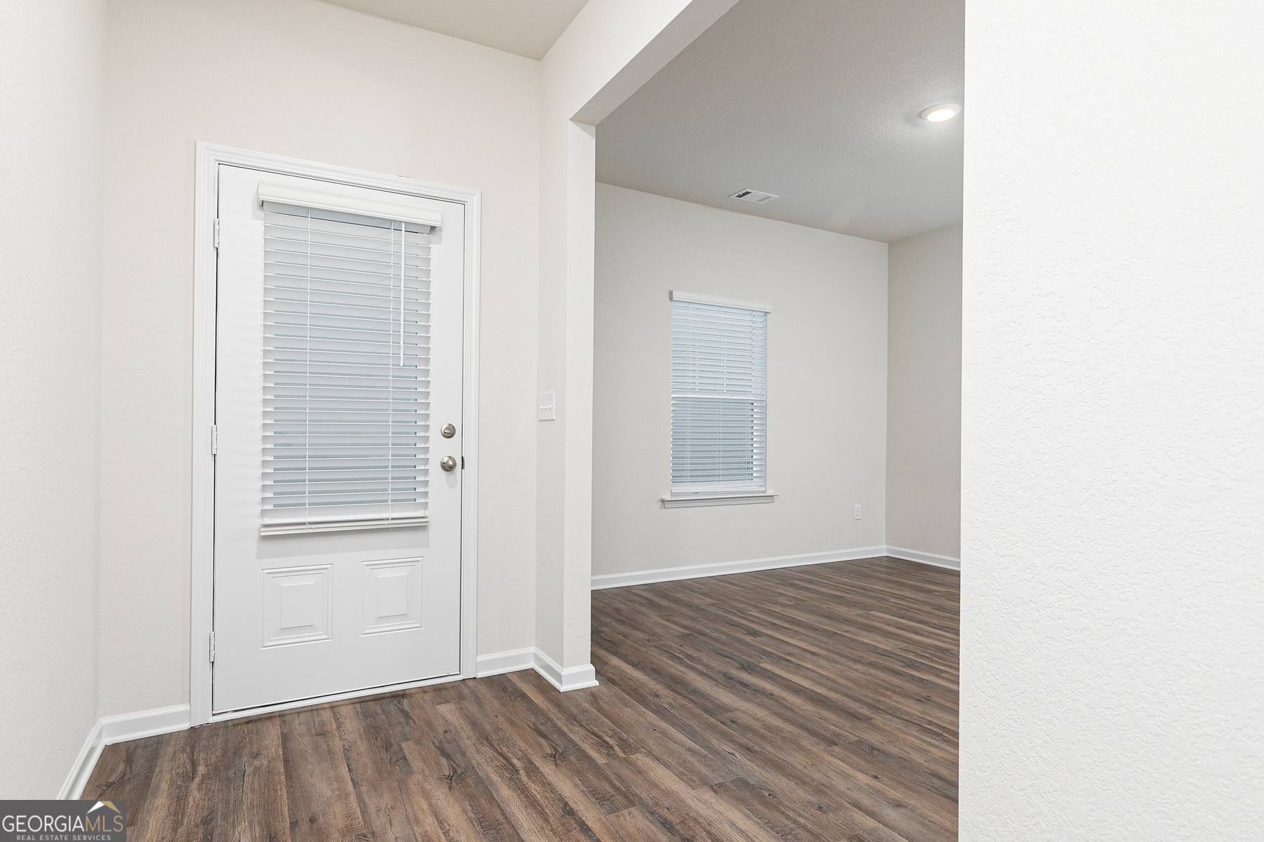 1513 Big Lane Locust Grove, GA 30248 - Photo 4 of 39 a view of a room with wooden floor and door