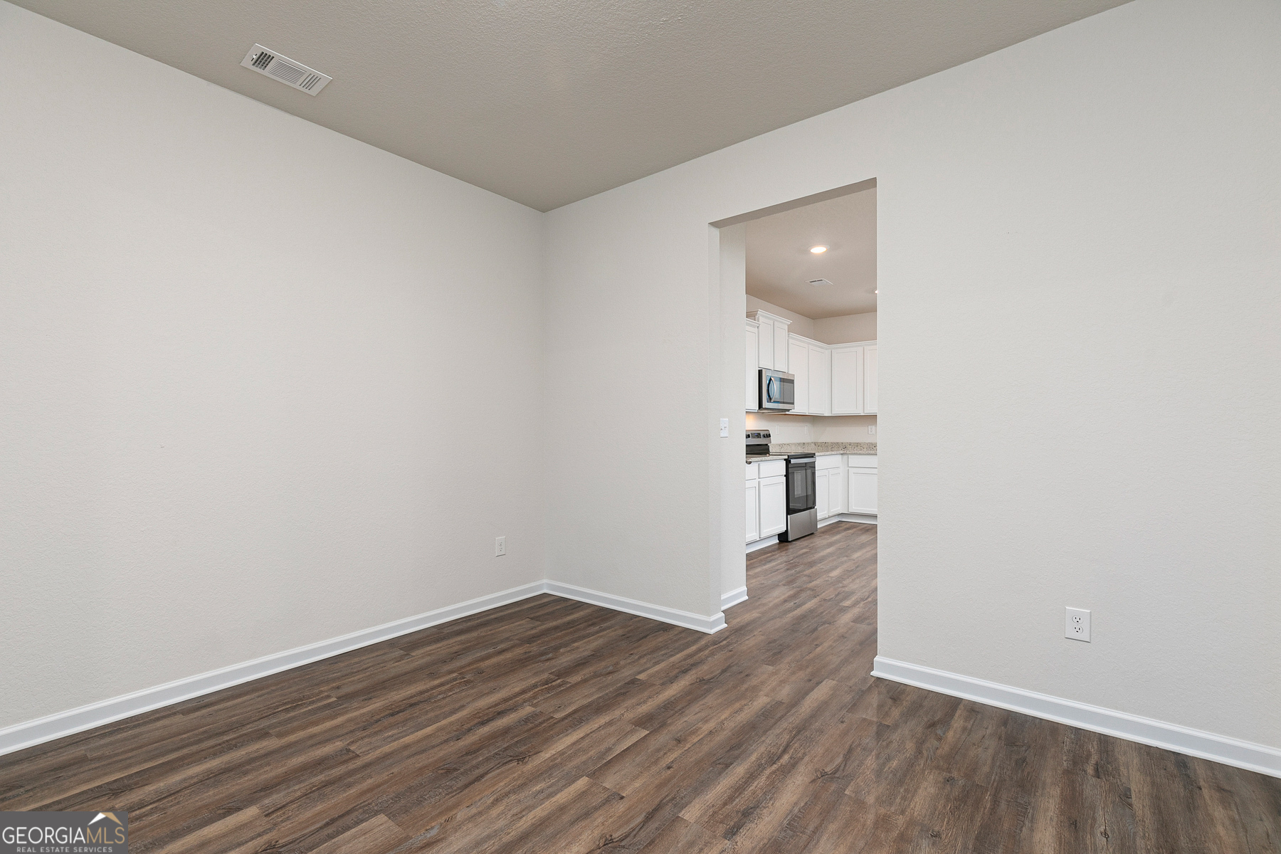 1513 Big Lane Locust Grove, GA 30248 - Photo 8 of 39 a view of empty room with wooden floor
