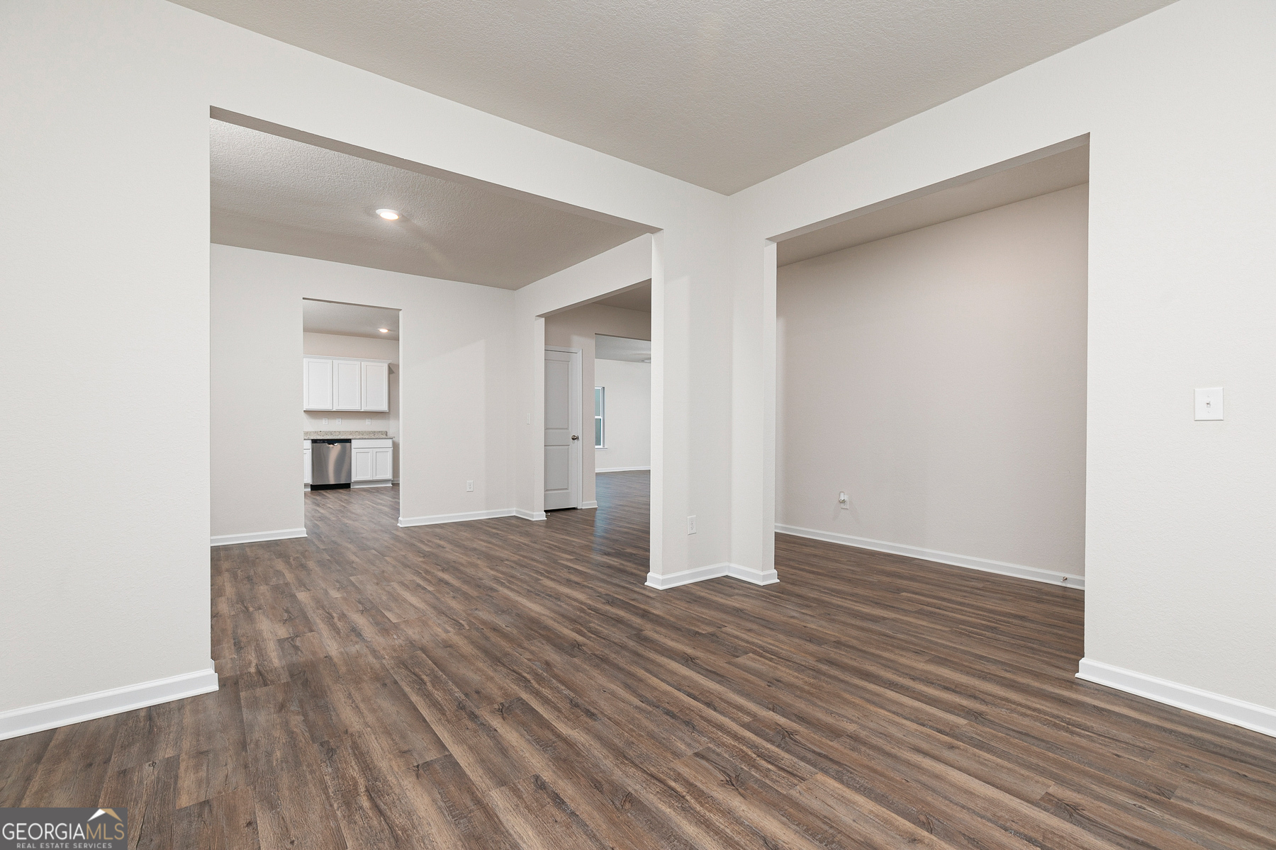 1513 Big Lane Locust Grove, GA 30248 - Photo 9 of 39 a view of an empty room with wooden floor and a window
