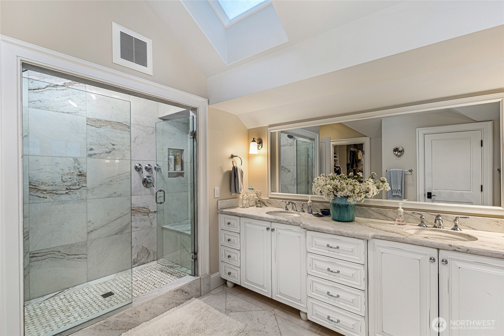 95 Laurel Point Lane Friday Harbor, WA 98250 - Photo 19 of 40 a bathroom with a shower sink and mirror