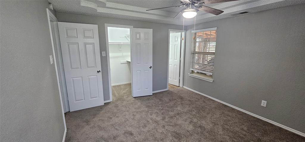 433 Ard Road Seagoville, TX 75159 - Photo 14 of 16 an empty room with windows and fan
