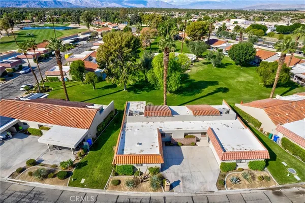 an aerial view of a house with a garden