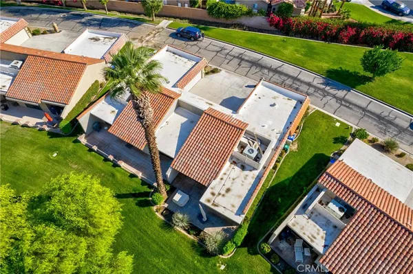 an aerial view of a house with a garden