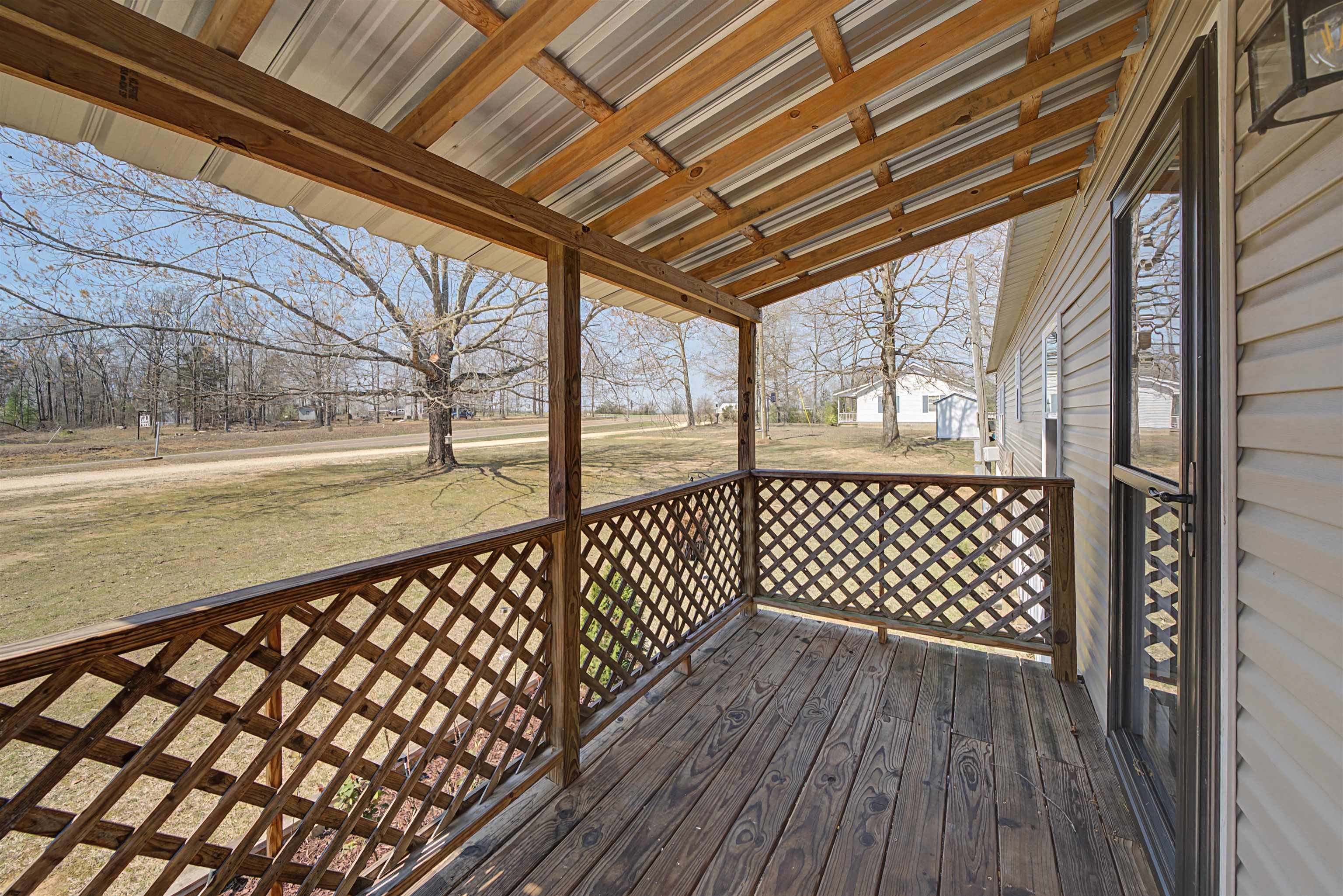 7010 22nd Highway Adamsville, TN 38310 - Photo 3 of 33 Deck featuring a yard