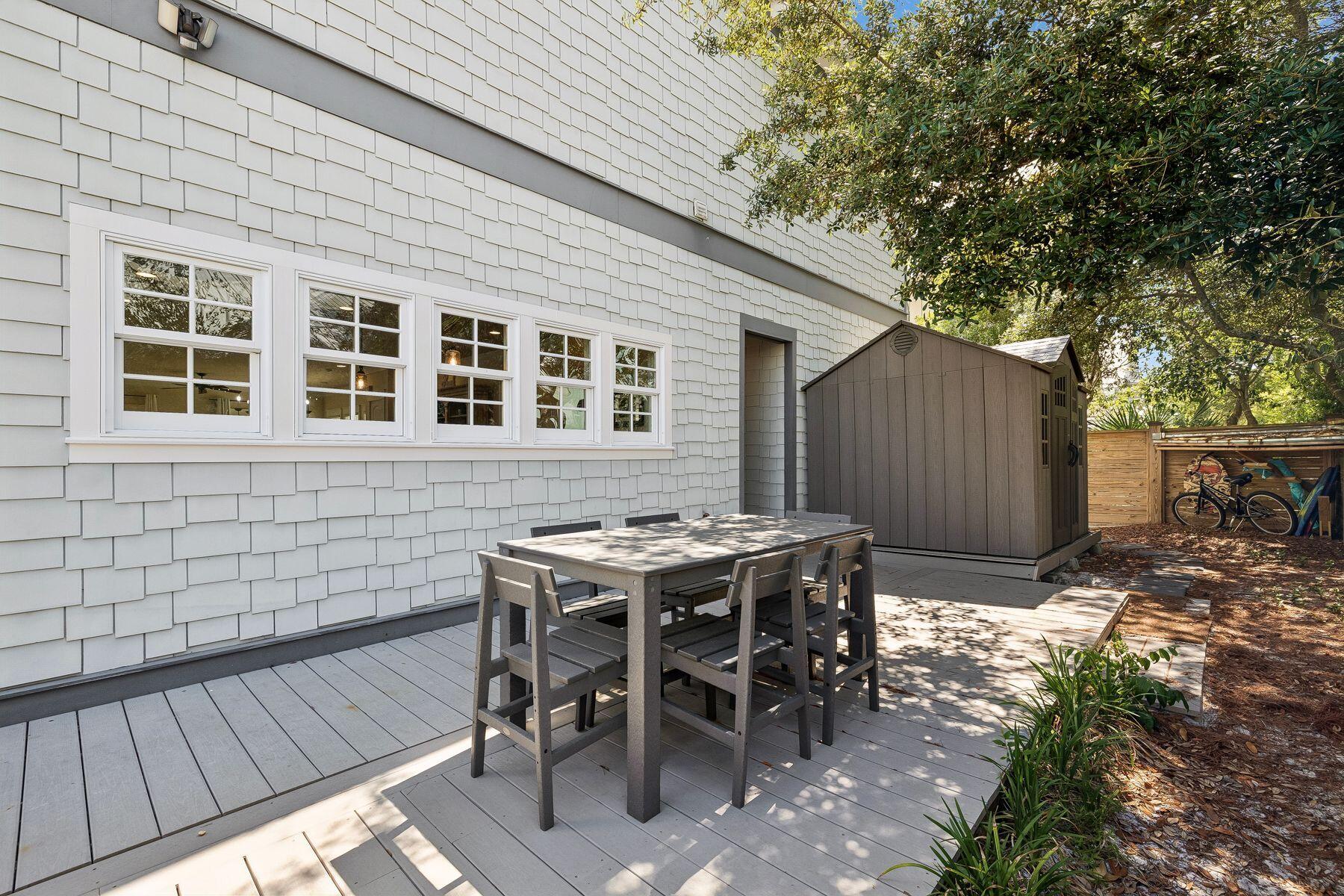 39 Willow Mist Road Inlet Beach, FL 32461 - Photo 29 of 41 a view of a dinning table and chairs in back yard of the house