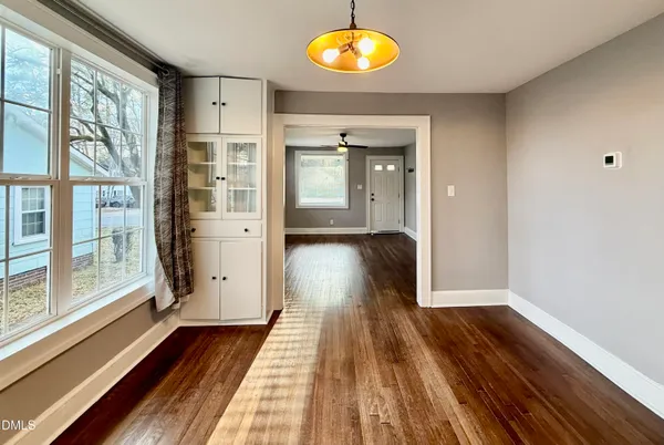 a view of a room with wooden floor